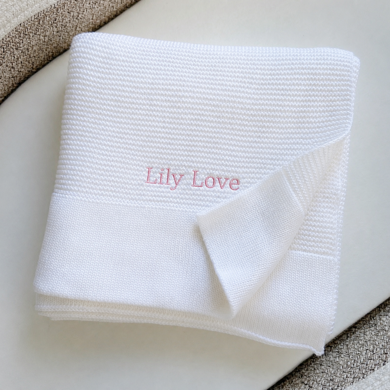 Premium bamboo cotton baby blanket showing soft cellular knit texture — breathable and hypoallergenic for newborn skin
