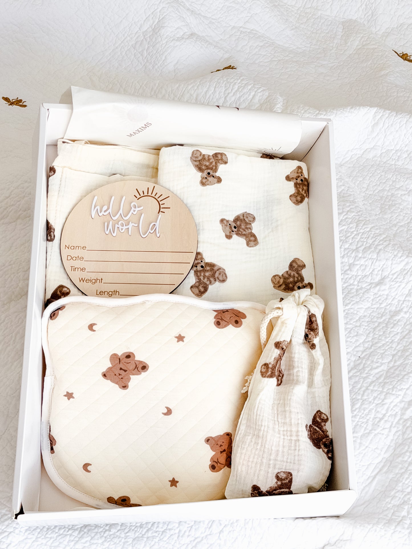 Maxims Gift Co. Hello Little Cub newborn gift box with teddy bear muslin blanket, anti-flat-head pillow, hello world milestone disc, brush set and bedside organiser — unisex baby gift in Dubai UAE
