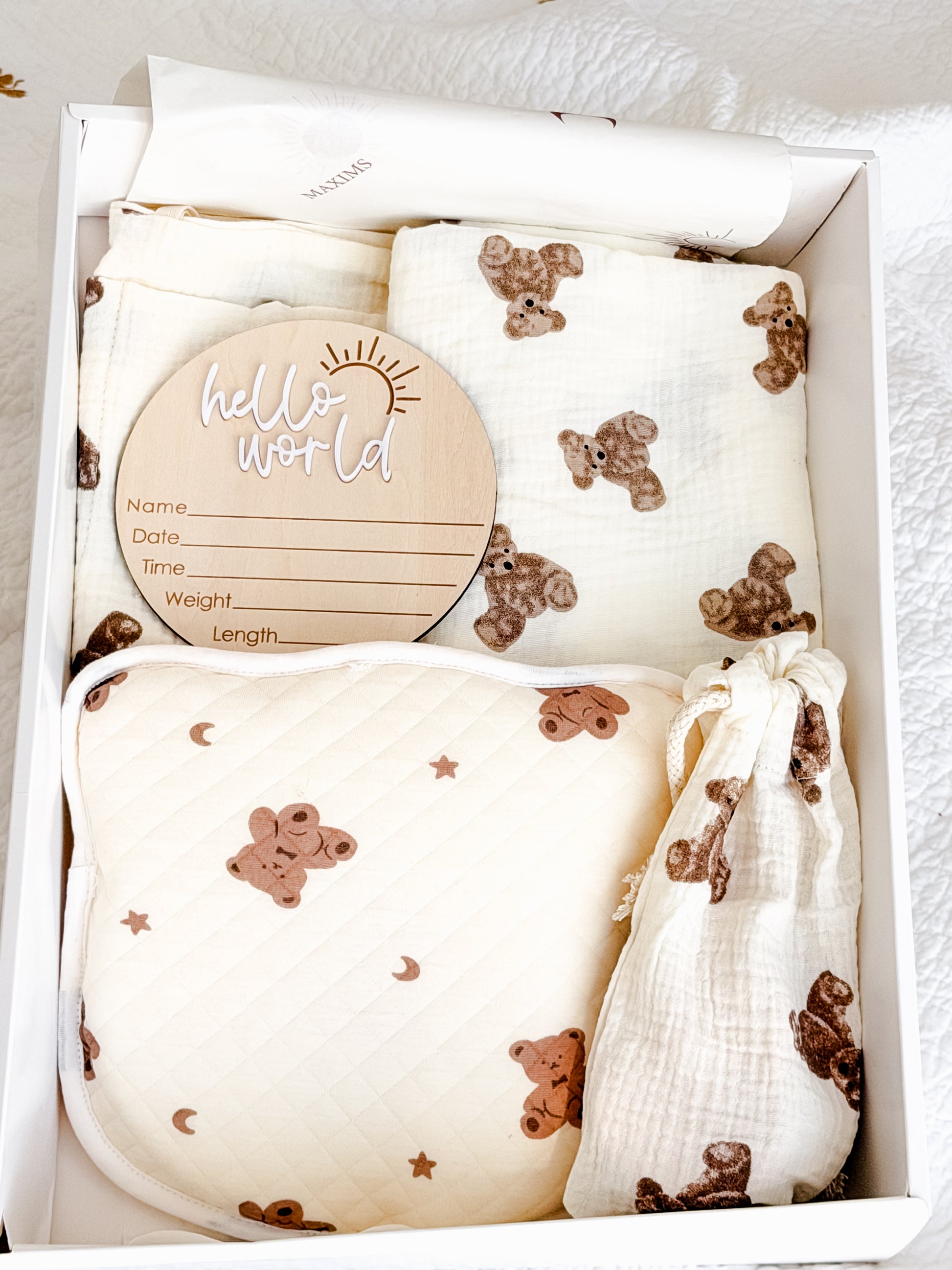 Signature Maxims Gift Co. unisex newborn gift hamper with teddy bear print muslin and quilted nursery essentials — perfect baby shower, Aqiqah and welcome home gift in the UAE
