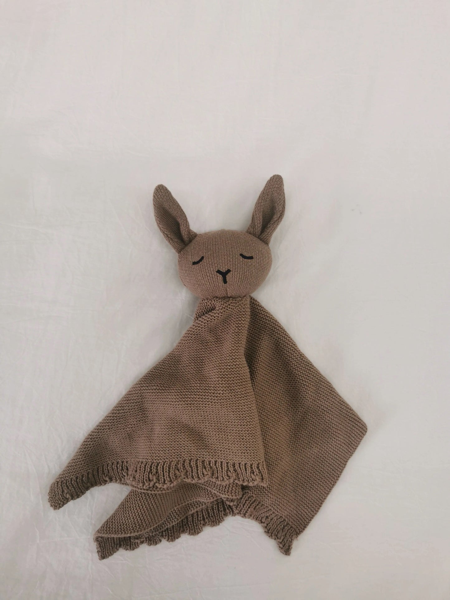 Mocha brown knitted bunny comforter lovey blanket with soft scalloped trim.