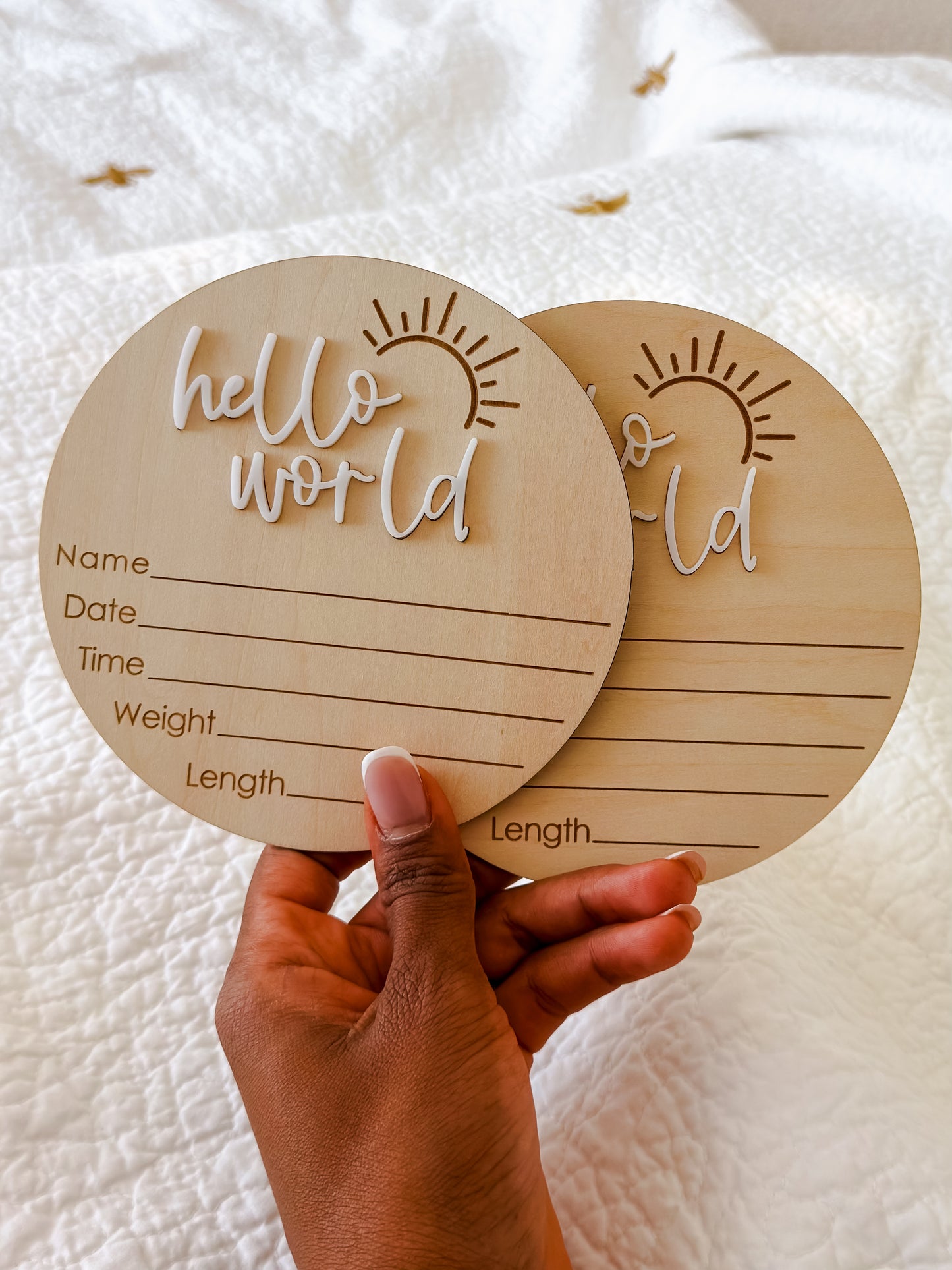 Hello World milestone disc styled as newborn birth announcement keepsake — beautiful baby photo prop for Dubai families
