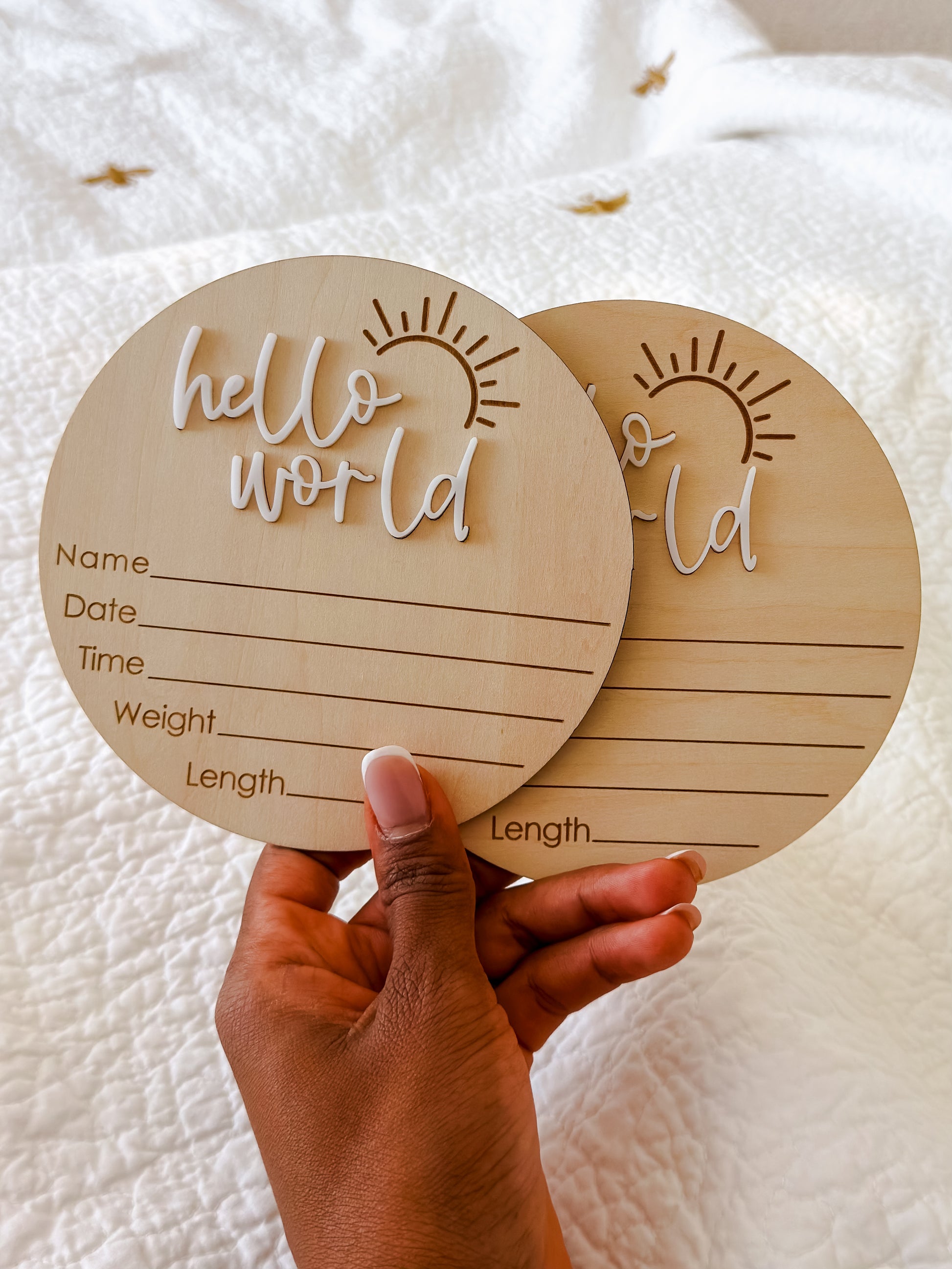 Hello World milestone disc styled as newborn birth announcement keepsake — beautiful baby photo prop for Dubai families
