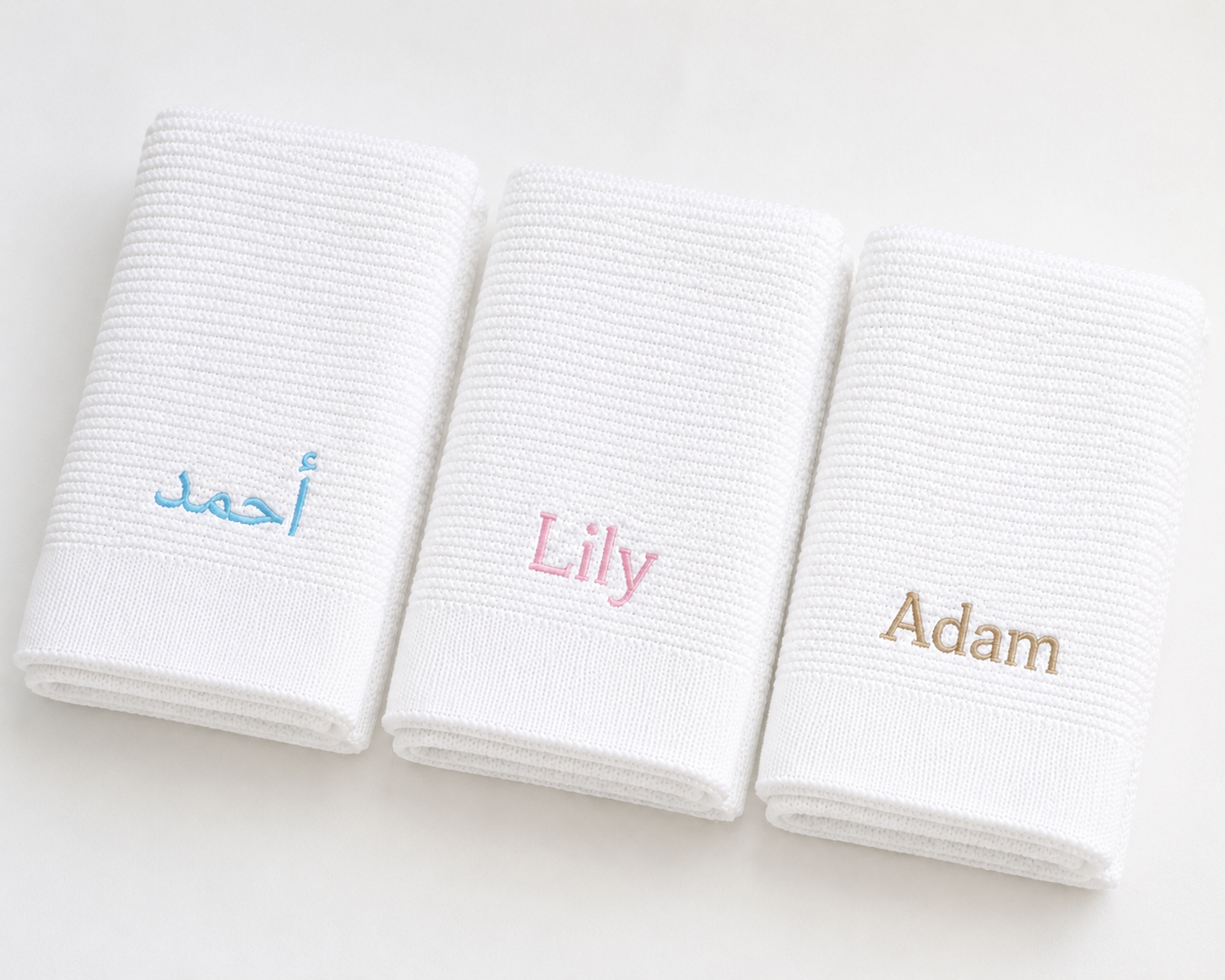 Personalised white bamboo cotton baby blankets with English and Arabic name embroidery — Maxims Gift Co. signature blanket Dubai UAE
