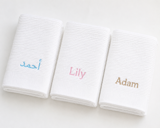 Personalised white bamboo cotton baby blankets with English and Arabic name embroidery — Maxims Gift Co. signature blanket Dubai UAE
