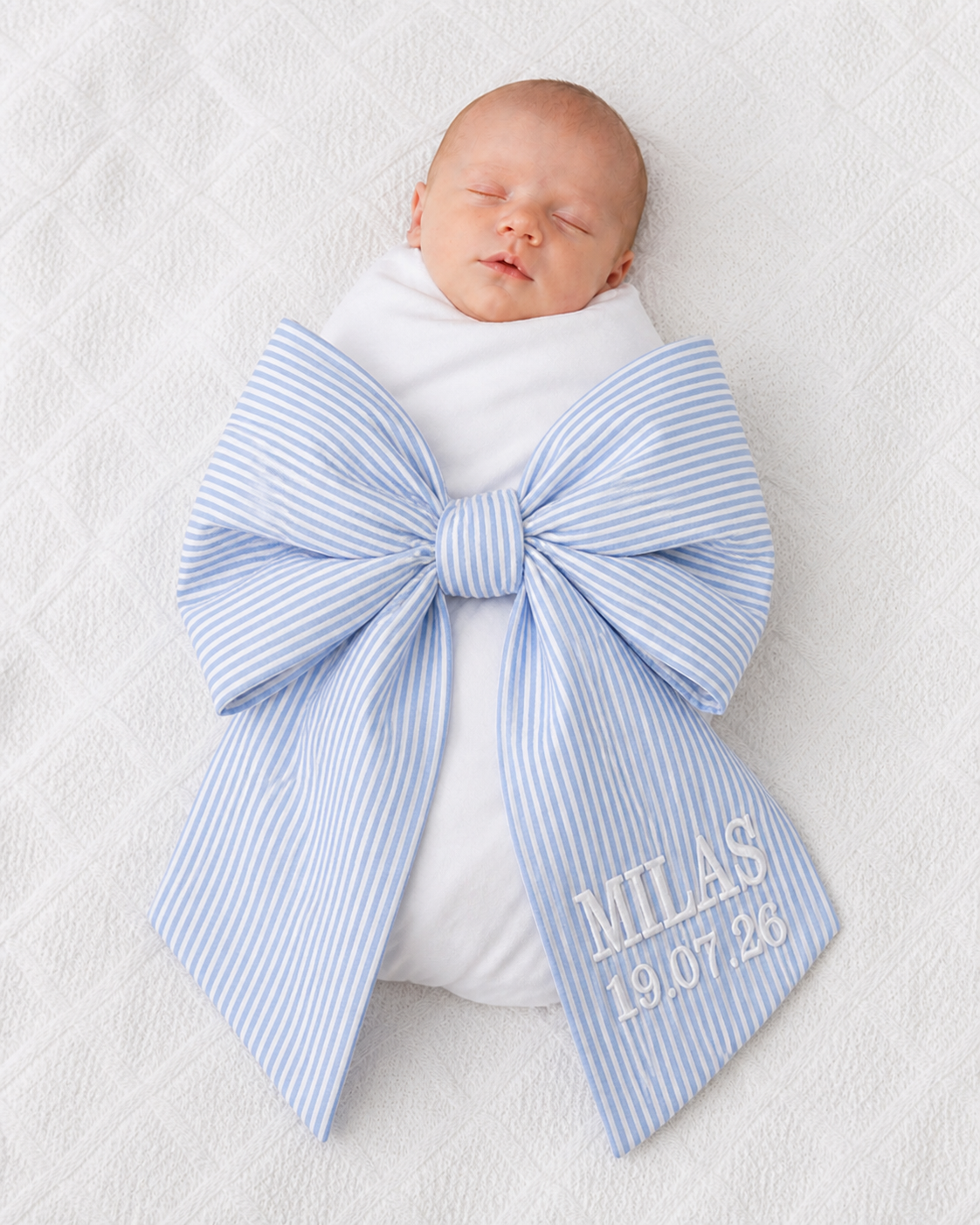 Newborn baby wrapped in personalised blue stripe bow sash with custom embroidery — Maxims Gift Co. Dubai UAE 
