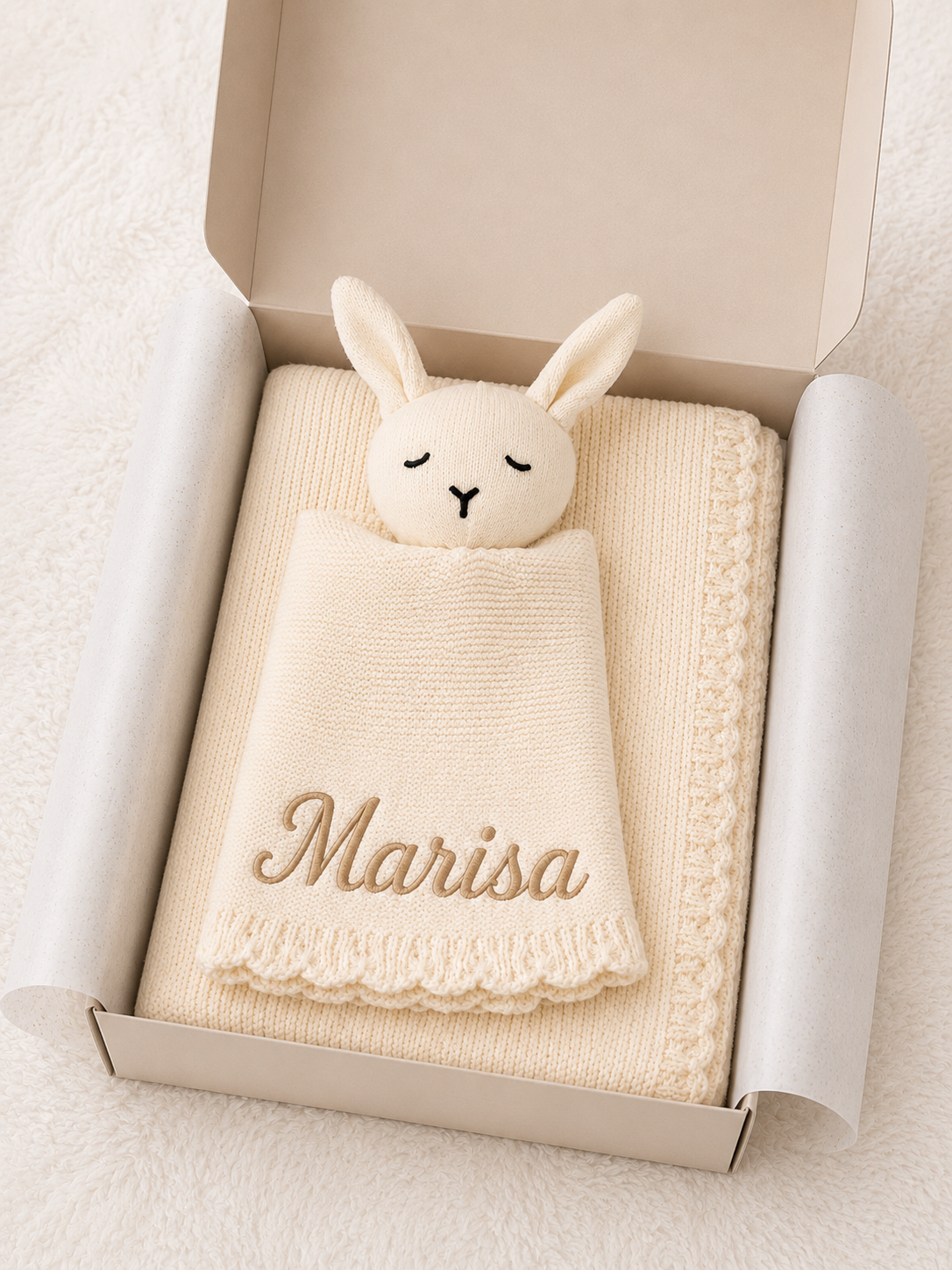 Close-up of embroidered name on personalised knit baby blanket — English or Arabic options, Maxims Gift Co. keepsake gift UAE
