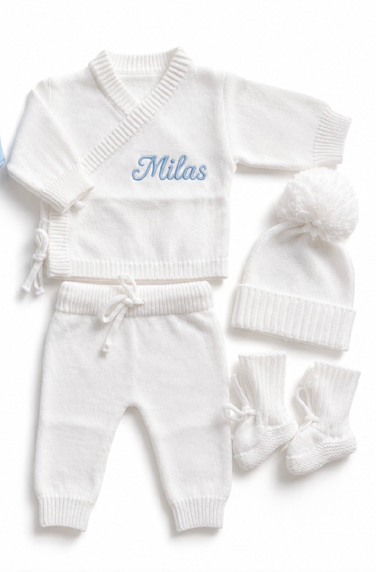 Detail view of personalised white bamboo cotton newborn knit outfit set with embroidered name — Maxims Gift Co. UAE
