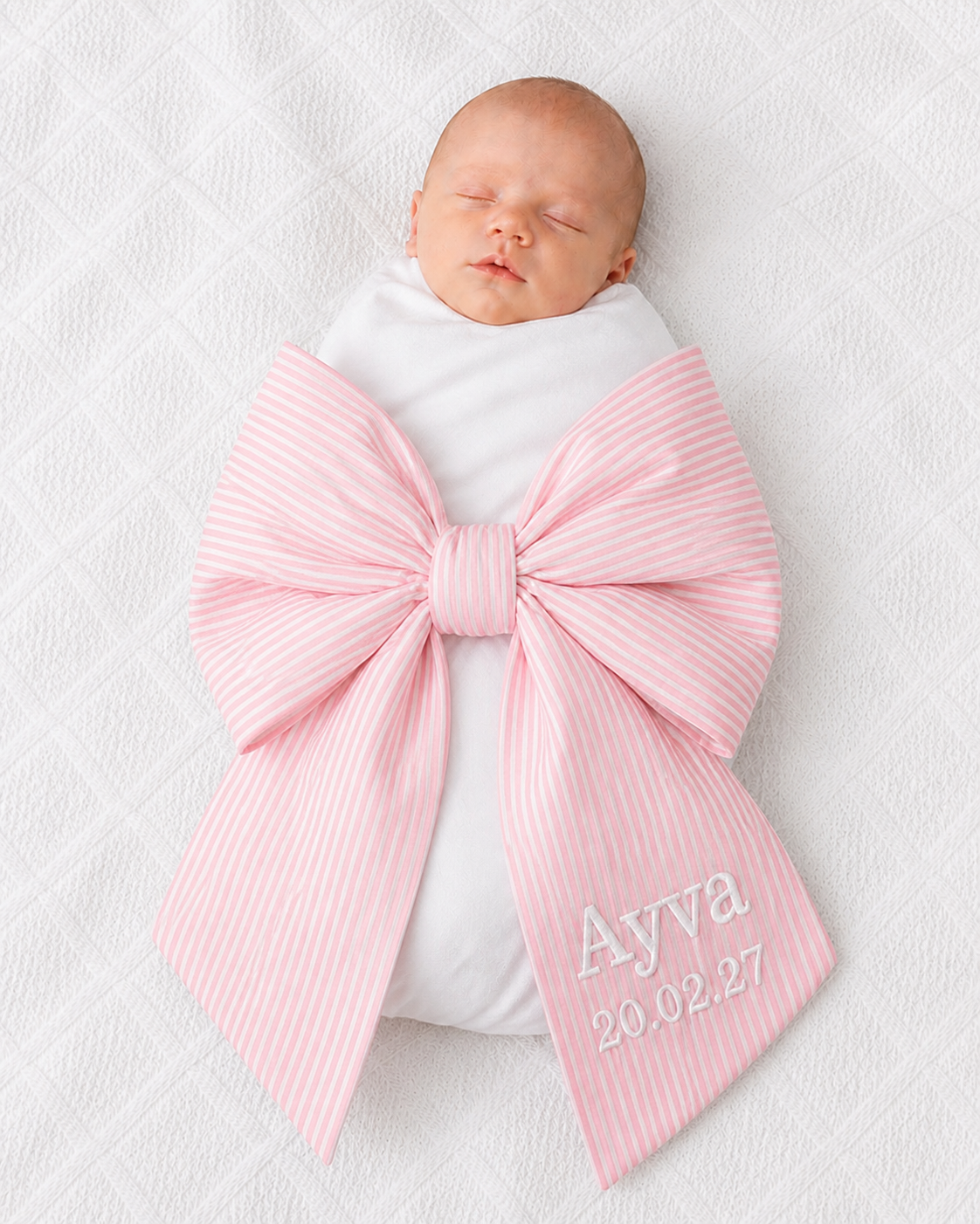 Newborn baby wrapped in personalised pink stripe bow sash with custom embroidery — Maxims Gift Co. Dubai UAE 