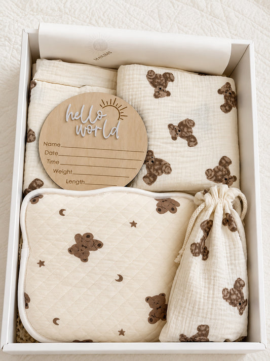 Unisex newborn baby gift box with teddy bear muslin blanket, quilted moon and stars blanket, hello world milestone disc, and matching drawstring pouch — Maxims Gift Co. UAE
